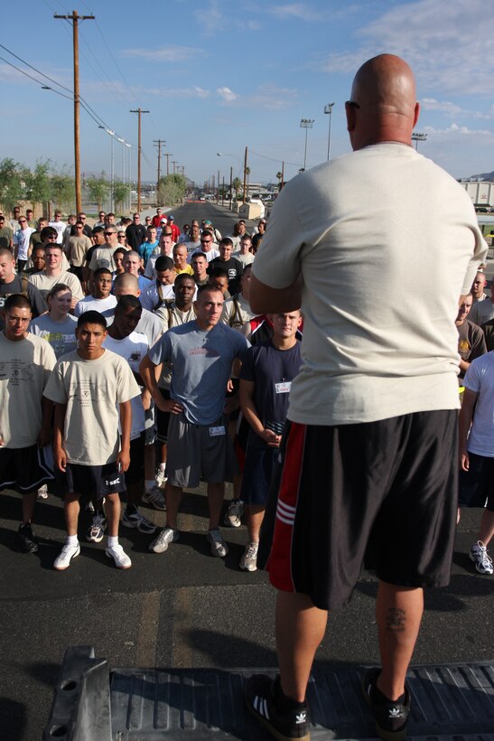 Sgt. Maj. Mark M. Geletko, the sergeant major of Headquarters Battalion, announces to runners the route of the first 5K Coyote Desert Fun Run beginning at Victory Field July 2.